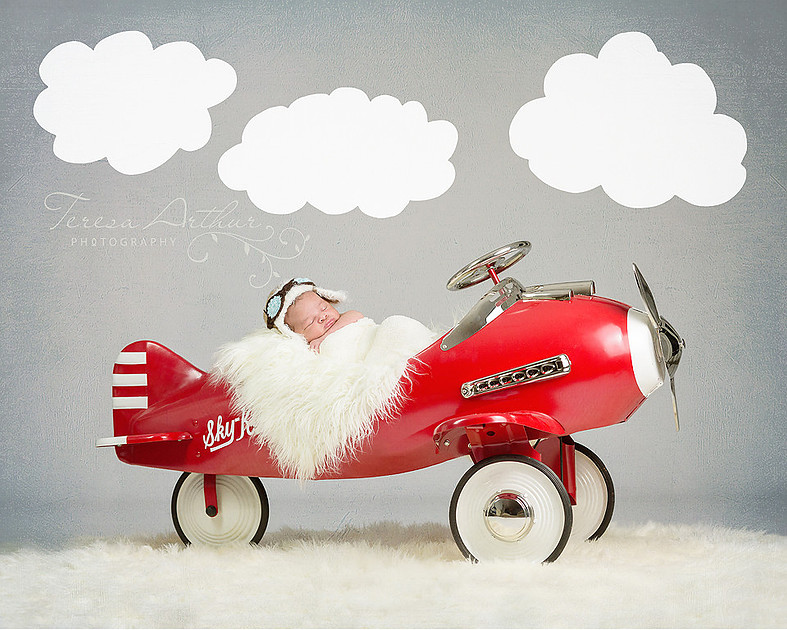 Newborn in airplane prop by Teresa Arthur Photography