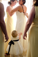 natural light bride getting into gown by teresa arthur photography