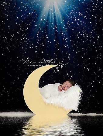newborn in moon prop portrait by teresa arthur photography